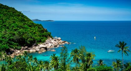 Breathtaking view of Koh Samui's tropical coastline with lush greenery and azure sea.